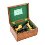 A Jaques & Son Staunton Chess Set, late 19th century, in natural and stained boxwood, kings 10cm