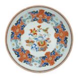 A Chinese Porcelain Saucer Dish, Yongzheng, painted in famille rose enamels with precious objects