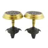 A Pair of Cast Iron and Brass Kettle Stands, mid 19th century, the circular tops formed from coal-