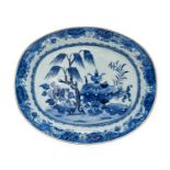 A Chinese Porcelain Meat Platter, Qianlong, of oval form, painted in underglaze blue with objects on