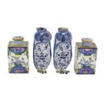A Pair of Delft Tea Canisters and Covers, 19th century, of rectangular form, painted in colours with