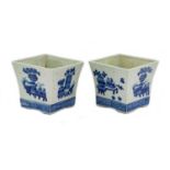 A Pair of Chinese Porcelain Planters, in Kangxi style, of flared square form, painted in