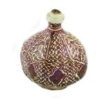 A Kashan Lustre Bottle, 12th/13th century, of square form with sloping shoulders and garlic neck,