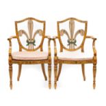 A Pair of George III Style Painted Wood Elbow Chairs, the shield backs with Prince of Wales' feather