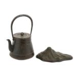 A Japanese Iron Tetesubin (Tea Kettle), 19th century, of conical form with loop knop and handles,