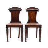 A Pair of William IV Mahogany Hall Chairs, with foliate and gadroon cresting, the lyre backs painted