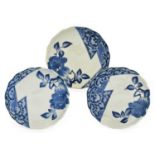 A Set of Three Arita Porcelain Dishes, 1680-1700, each painted in Nabeshima style in underglaze blue