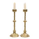 A Pair of Victorian Brass Candlestands, in gothic style,with pierced ovoid bowls on wrythen-fluted