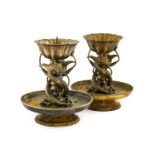 A Pair of Chinese Silvered and Parcel-Gilt Pricket Candlesticks, Qing Dynasty, each with
