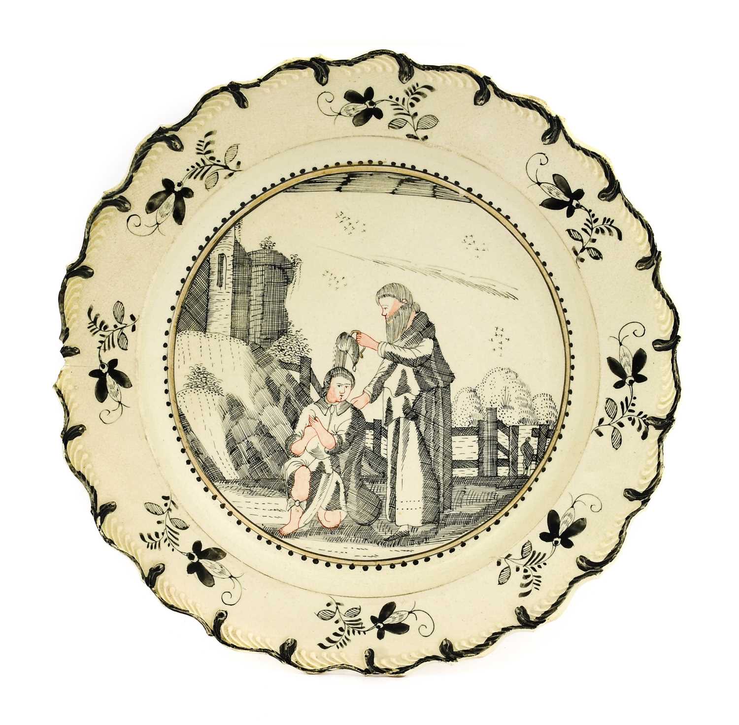 A Dutch Decorated Creamware Plate, circa 1780, pencilled in Jesuit style en grisaille and with flesh