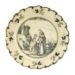 A Dutch Decorated Creamware Plate, circa 1780, pencilled in Jesuit style en grisaille and with flesh