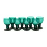 A Matched Set of Eight Green Glass Roemers, 19th century, the ovoid bowls on hollow stems with