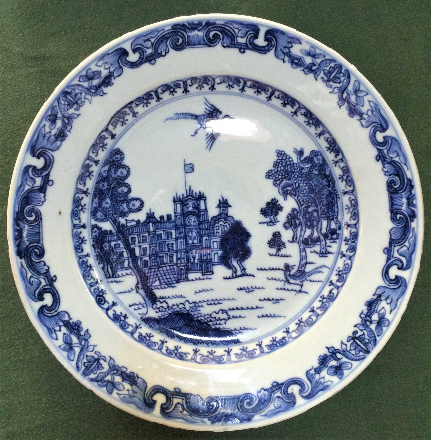 A Chinese Porcelain European Subject Plate, Qianlong, painted in underglaze blue with a palace in - Image 3 of 10