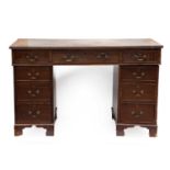 A Mahogany Pedestal Desk, circa 1900, the rectangular top with leather skiver over an arrangement of
