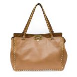 Valentino Garavani Trapeze Poudre Rockstud Leather Shoulder Bag, in a soft leather bearing gilt