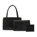 Circa 1960s Gucci Black Crocodile Handbag, with twin handles, gilt metal mounts to the corners and