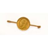 A half Sovereign Dated 1914 Mounted as a Bar Brooch, length 5.0cmBrooch is stamped but the marks are