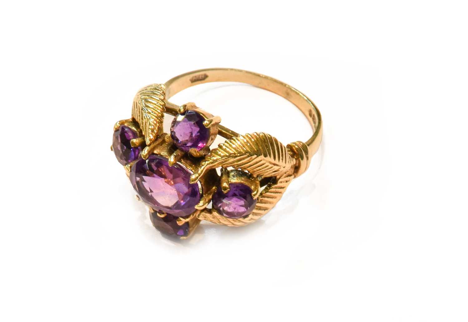 A 9 Carat Gold Amethyst Cluster Ring, finger size O1/2Gross weight 6.3 grams.