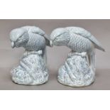 A Pair of Bretby Parrots, raised on naturalistic bases and decorated in blue glaze, impressed marks,