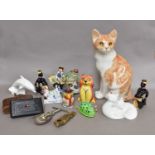 A Winstanley Pottery Cat, together with a pair of Royal Doulton cats, a Lorna Bailey cat, Poole