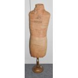 A Circa 1930s Mannequin Stencilled J B Masterfront, mounted in cream cotton, 120cm (a.f.)