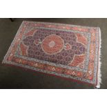 A Rug of West Iranian Design, the Herati field with terracotta medallion framed by spandrels of