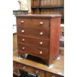 An Edwardian Mahogany Apprentice Chest of Four Drawers, with stepped rectangular top and turned