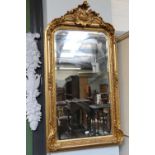 A Large Reproduction Gilt Framed Wall Mirror, with Neo-Rococo pediment and bevelled plate, 86cm by