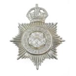 An Anglesey Constabulary Helmet Plate, in die stamped white metal, with King's crown over star,