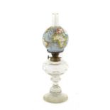 An Austrian Glass Oil Lamp, early 20th century, the opaque white glass shade printed and overpainted