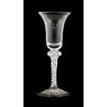 An Opaque Twist Wine Glass, circa 1750, the bell-shaped bowl on a knopped opaque twist stem and