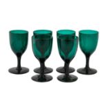 A Set of Six Green Glass Wine Glasses, early 19th century, the ovoid bowl on plain stems and