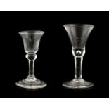 A Dwarf Wine Glass, circa 1750, the thistle shaped bowl with basal air tear, on a plain stem and