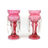 A Pair of Cranberry-Flashed Clear Glass Table Lustres, circa 1900, the ovoid bowls engraved with