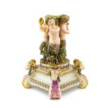 A Meissen Porcelain Centrepiece Base, late 19th century, modelled as three Bacchic cherubs playing