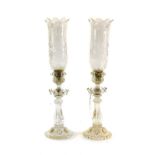 A Pair of Baccarat Candle Holders, the fluted urn-shaped socket on petal-moulded drip pans, fluted