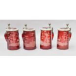 A Set of four Ruby Glass Tankards, possibly German, with pewter mounts and engraved with scenes of
