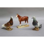 A Royal Doulton Model of a Pony, HN2571, together with two Beswick models of Pigeons model No.