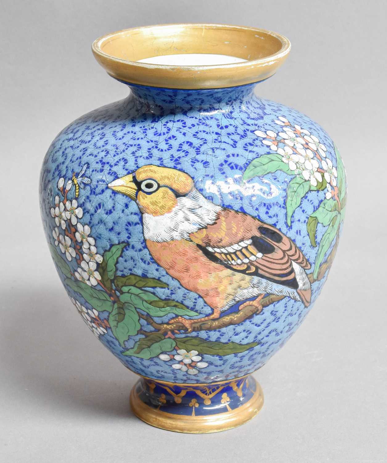 A French Porcelain Vase, signed Eugene Rousseau, Paris, decorated with finches on a blue ground,