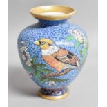 A French Porcelain Vase, signed Eugene Rousseau, Paris, decorated with finches on a blue ground,
