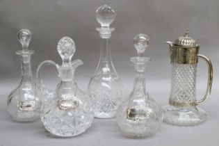 A Pair of Cut Glass Decanters, with silver decanter labels for Brandy and Sherry, a silver plate