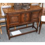 A 17th Century Style Carved Oak Side Cabinet, 117cm by 35cm by 85cm