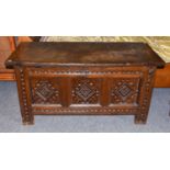 A Carved Oak Three Panel Coffer, 18th century, each front panel carved with a lozenge, 122cm by 50cm