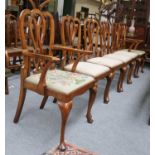 A Set of Six Georgian Style Walnut Dining Chairs, including two carvers