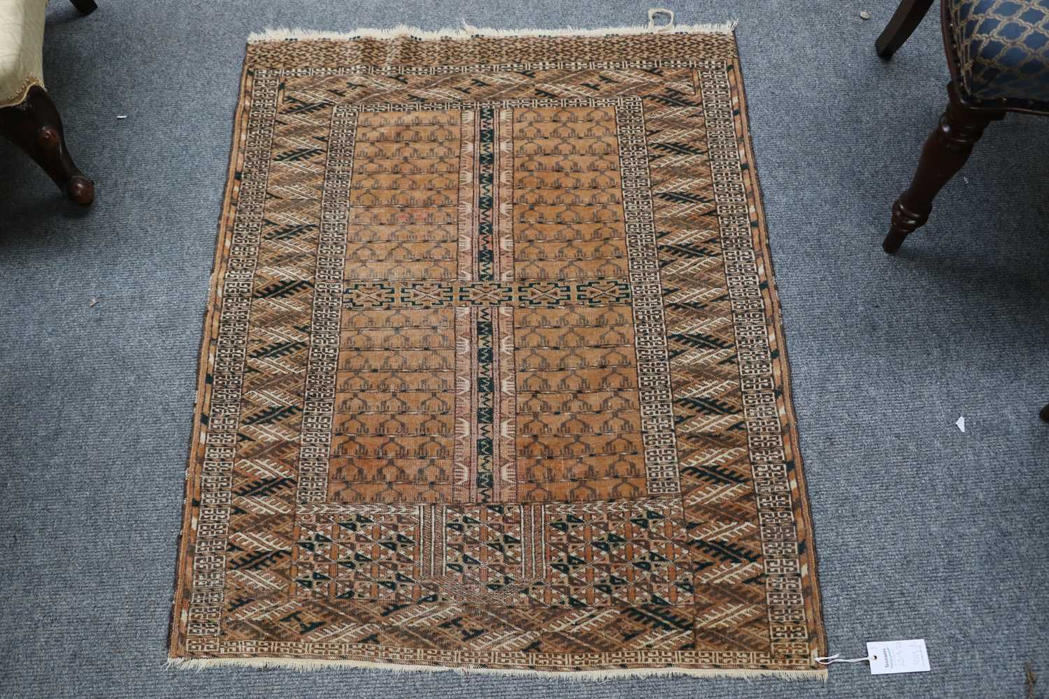 A Kuba Rug, the indigo field with two rows of stylised flowerheads enclosed by Harshang borders,