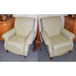 A Pair of Modern Armchairs, on turned legs moving on castors81cm by 90cm by 92cm.