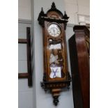 A Vienna Walnut Veneered Wall Timepiece, circa 1890, the enamelled dial with Roman numerals,