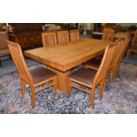 A Large Modern Oak Dining Table, on two block supports, 220cm by 101cm by 75cmTen Matching