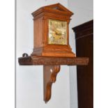 A German Oak Cased Chiming Table Clock, with architectural pediment, the 7 inch brass dial with