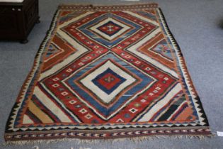 Kashgai Kilim, the field with stepped radiating polychrome medallions, framed by similar spandrels